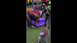 Tourist puts his bald HEAD in fish spa... before police tell him off