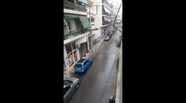 Unusually strong rain in Athens Greece, flooding streets, on May 13th.