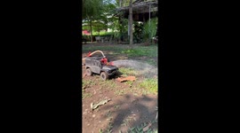Resident attaches garden hose to remote-controlled car to water garden