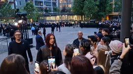 Singer Dua Lipa greets fans as she arrives for Gucci Cruise show at Tate Modern
