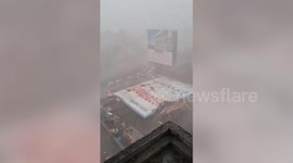 Longer Version: Officials come to rescue after hoarding collapses due to strong wind in western india