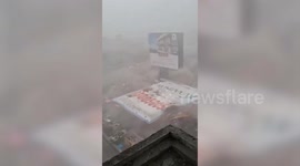 Moment 100ft billboard fell in storm - killing 14 and injuring 74