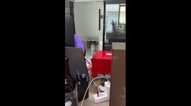 Cat frantically scratches glass office door