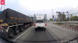 Motorcycle rider filtering through traffic hit by lorry