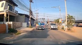 Passenger falls from pickup truck when tailgate opens