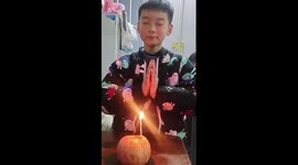 Poor boy blows out candle on apple and wishes to be rich
