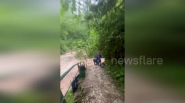 Rescue teams save hiker stranded on rising river in Russia