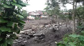 Locals cut off by flooding cross makeshift bridge in Indonesia's West Sumatra