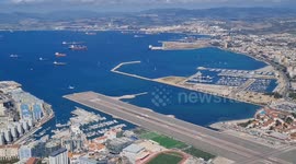 Commercial aircraft landing at Gibraltar airport, as seen from the top of the rock. Looking down from above.