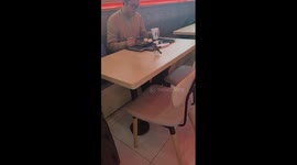 Sparrow lands on table to join passenger for breakfast at Shanghai airport