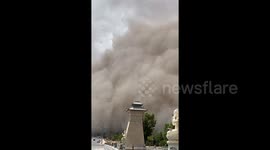 Giant wall of sand shrouds Chinese city in murky yellow dust
