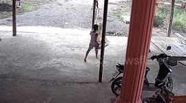 Boy falls on the ground while swinging hammock