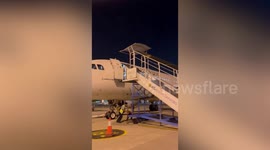 Airport ground worker falls from plane when bungling colleagues remove steps