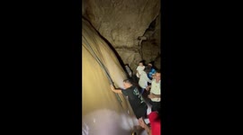 Cancer survivor with amputated leg climbs cave