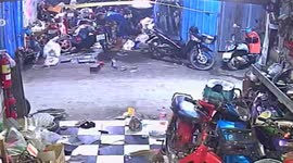 Motorcycle catches fire sparking panic among shop staff