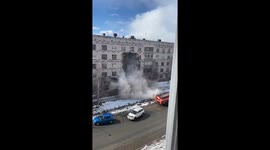 Abandoned building partially collapses as pedestrians walk past in north Russia