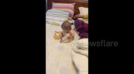 China: A Baby's Unfazed Tumble