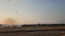 Children fly kites in rice fields in Vietnam
