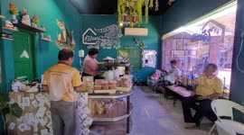 Snappuccino, please! Crocodile lives at this cafe in Thailand