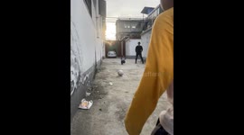 Children playing football with father, youngest son gets accidentally hit