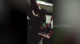 Buddhist monks wrestle with thief caught stealing from donation box