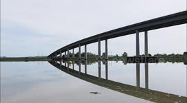 Mirror calm morning at the Sheppey Crossing in Kent, UK