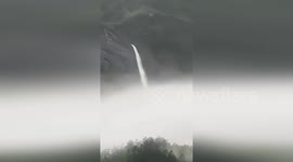 Optical illusion makes it look like a waterfall in the sky