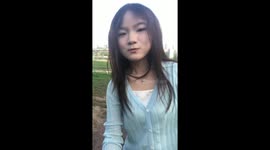 Girl slips in mud while trying to pose for video