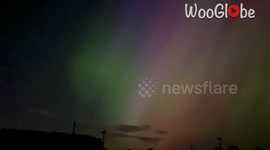 Aurora Borealis shines bright over Whitelee Windfarm during magical solar storm