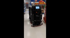 AI driven robotic floor cleaner in Ontario Canada Walmart store with no human operator as Ai continues to wipe out jobs from all sectors of the economy