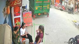 Rampaging cow charges into girls sitting outside shop in India