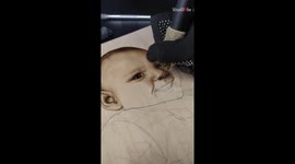 Wooden whispers: Pyrography portrait captures a child's tender beauty