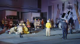 USA: Vehicle Crashes and Lands Vertically on Building in Vernon, LA