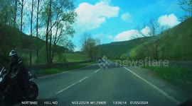 Biker brakes heavy after overtake of cammer causing cammer to brake for no reason!