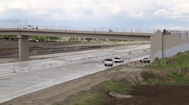 Light aircraft takes off from road construction following emergency landing