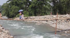Challenging Maud when crossing an emergency bridge in West Sumatra, Indonesia