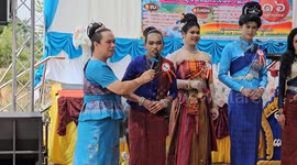 Thai ladyboys imitate buffalo sounds during cattle blessing festival