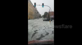 Storm brings hails to Poland, blanketing streets in hail