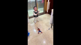 Terrified child recoils from Spiderman toy brandishing toy gun