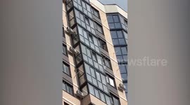 Toddler seen perched on 22nd floor window sill taken into care