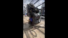 Postman stacks motorcycle with 10ft tall tower of parcels