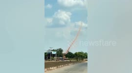 Brown earth dust devil tornado whirls through Laos
