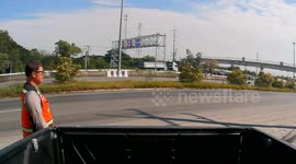 Pickup truck drifts and flips over road