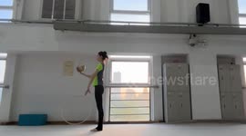 Chinese girl demonstrates smooth gymnastic moves
