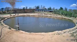 Chinese fisherman narrowly avoids being struck by heavy metal sheet swept away by powerful tornado
