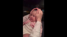 Doting mum styles baby girl's hair like a firecracker