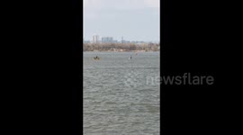 China: Man Walking on Water in Songhua River