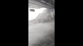 Passenger caught in violent squalls battering train station in Thailand