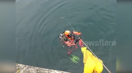 Firefighters retrieve submerged van from sea in northeast Italy
