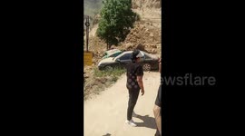Landslide on highway causes damage to cars and injures two